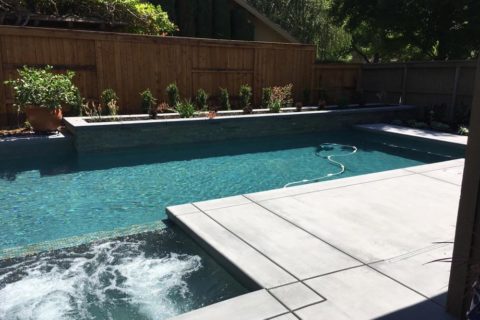 new construction pool with attached hot tub